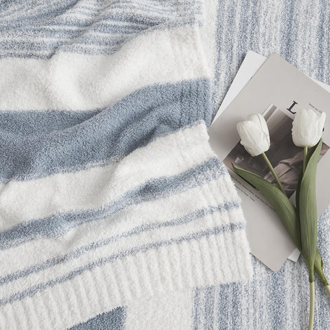 WRENSONGE grey blue throw blanket folded on bed showing stripes
