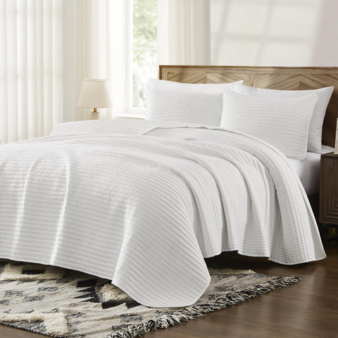 WRENSONGE king-size quilt on bed adds a lightweight finish.