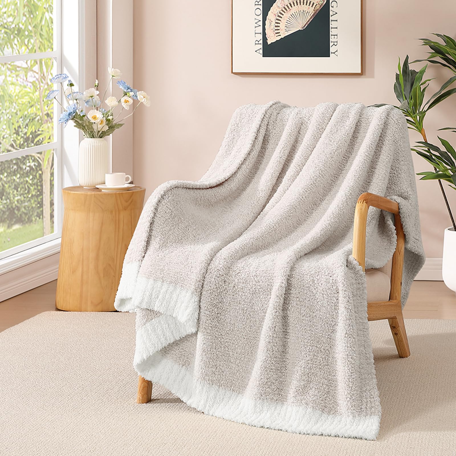 WRENSONGE throw blanket on couch in taupe, providing cozy warmth for evenings