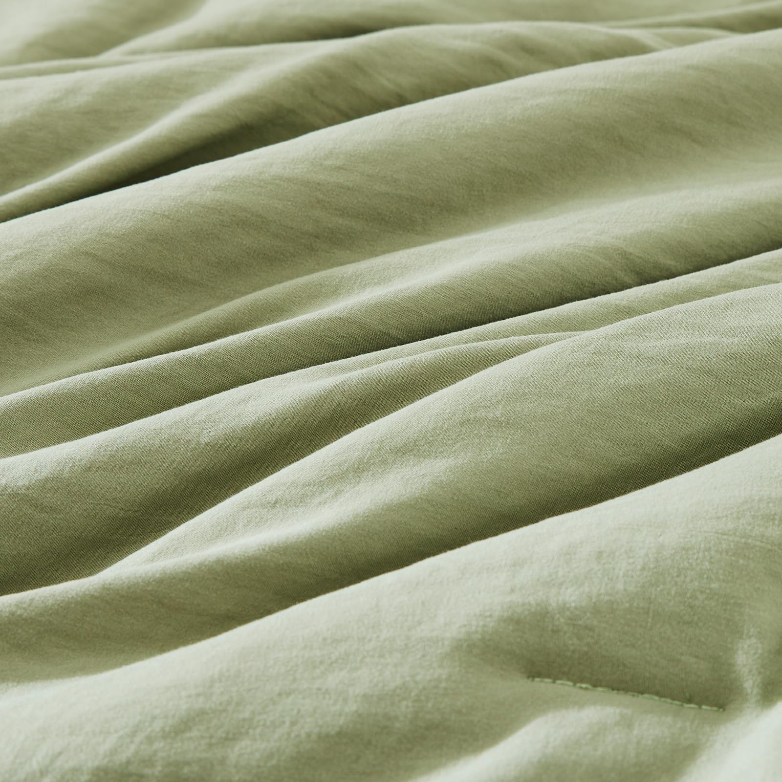 WRENSONGE pillow sham in matching sage provides coordinated bedroom look.
