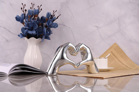 WUBIANJIE Silver Heart Hands Sculpture shelf display provides a unique art deco accent