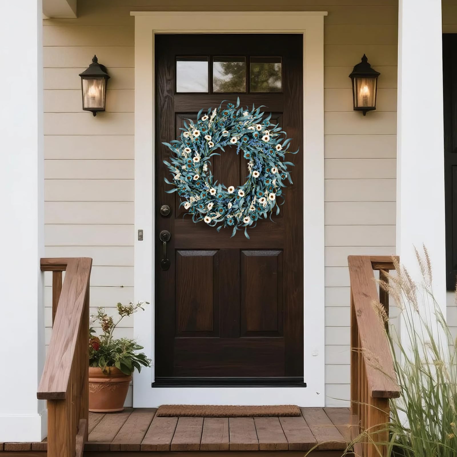 wwmira blue daisy wreath on entryway wall complements neutral farmhouse interiors.