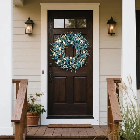 wwmira blue daisy wreath on entryway wall complements neutral farmhouse interiors.
