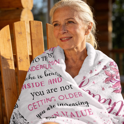 XALAZY blanket 50x60 draped on bed offers cozy warmth for daily comfort.