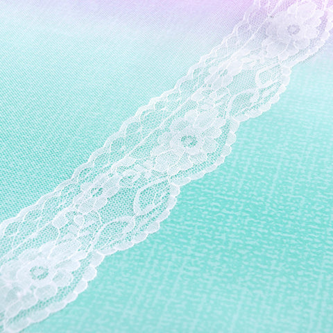 Sheer mesh fabric with lace edges adds delicate texture