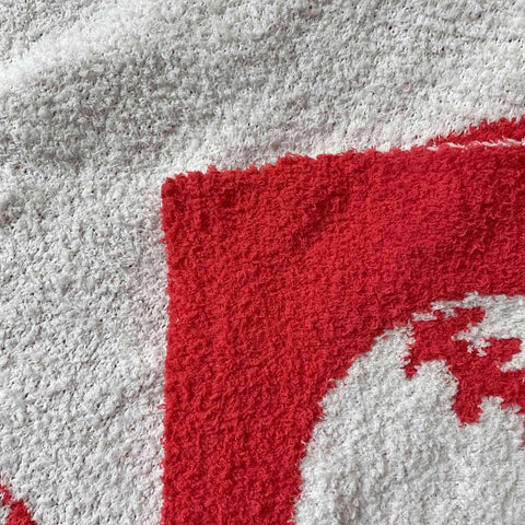XING7DAY baseball-pattern blanket draped over sofa for lounging warmth