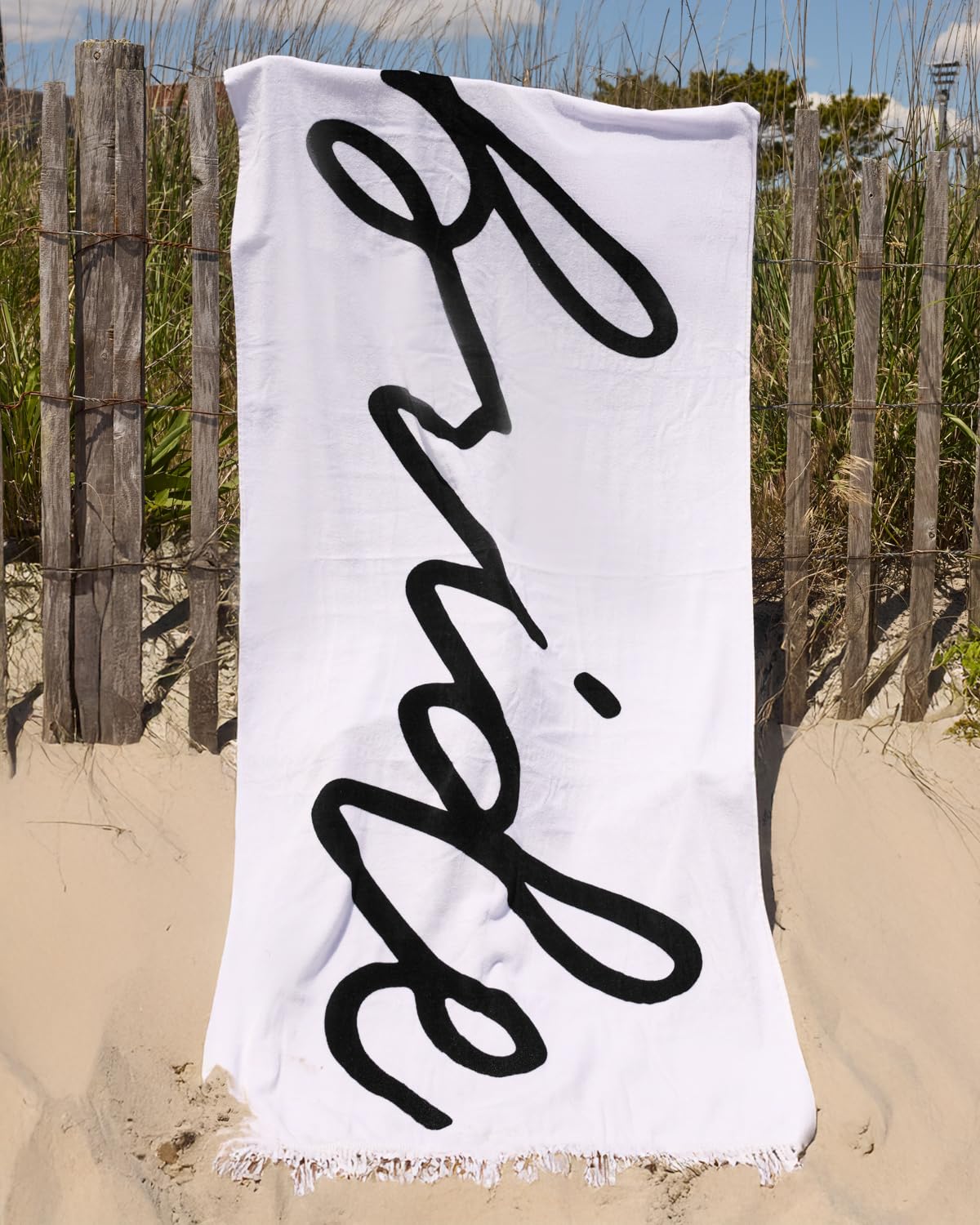 xo Fetti Bride Fringe Beach Towel folded gift-ready packaging.