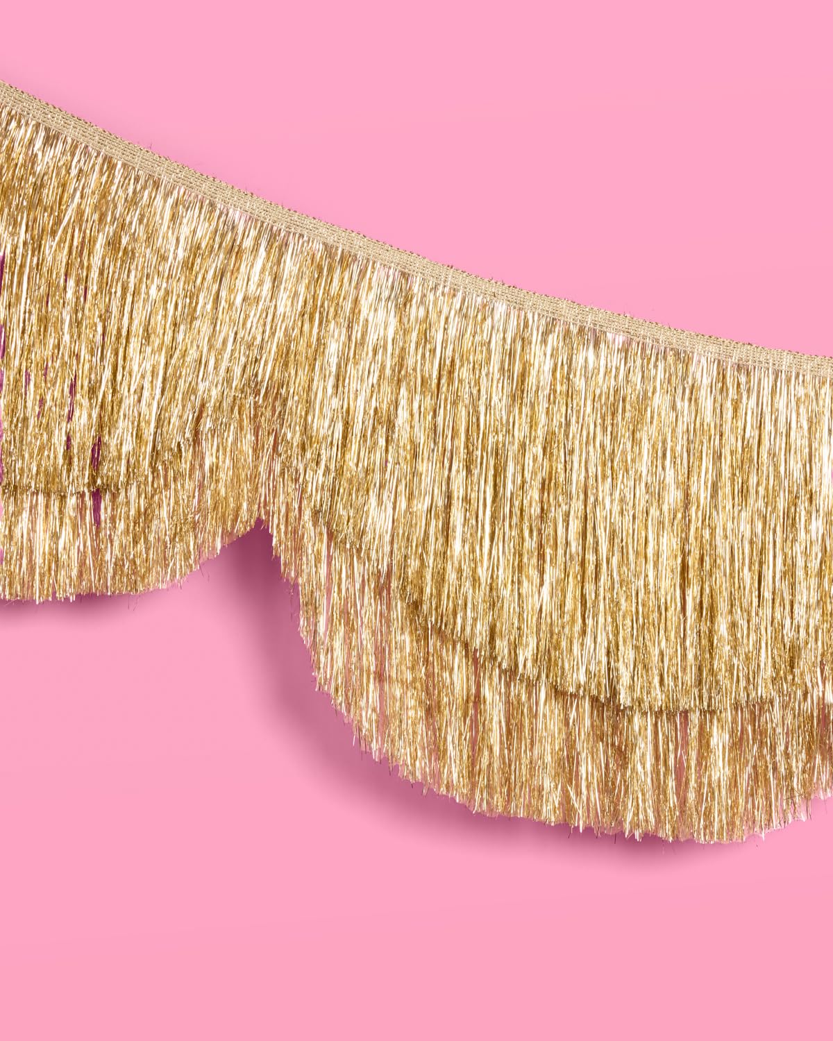 xo, Fetti gold banner on wall creates a sparkling backdrop for celebrations