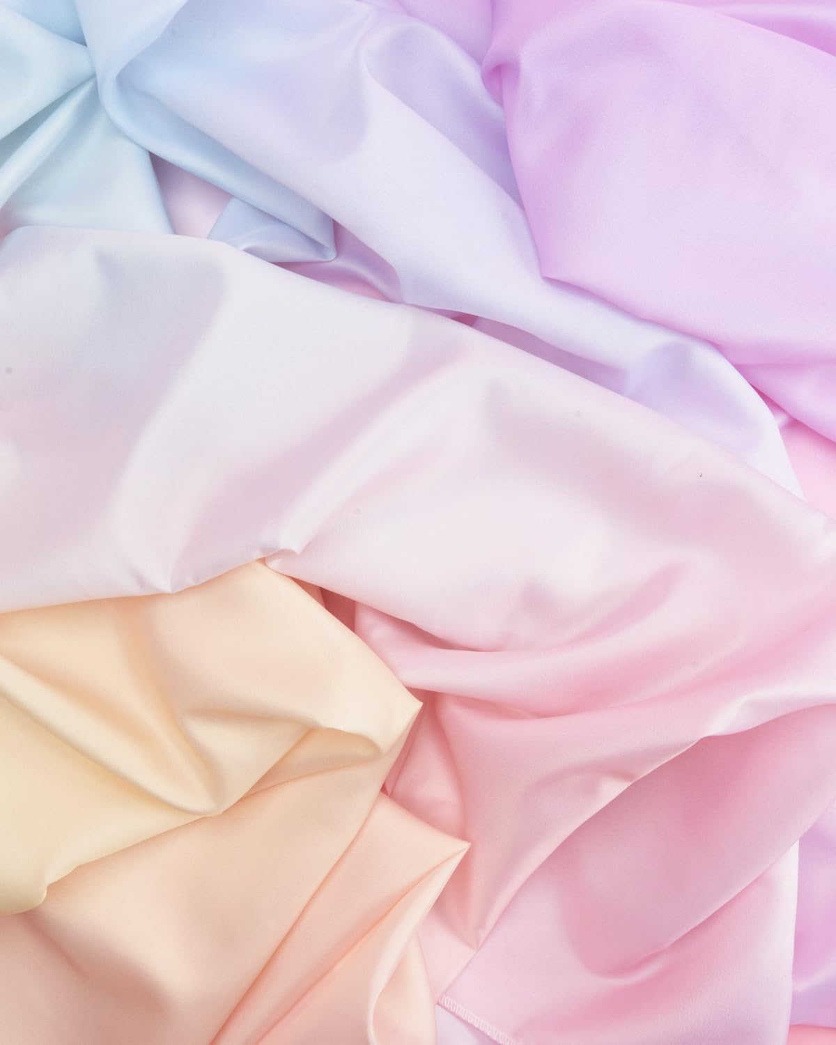 xo, Fetti pastel-gradient tablecloth on an outdoor dining setup for a sunny party