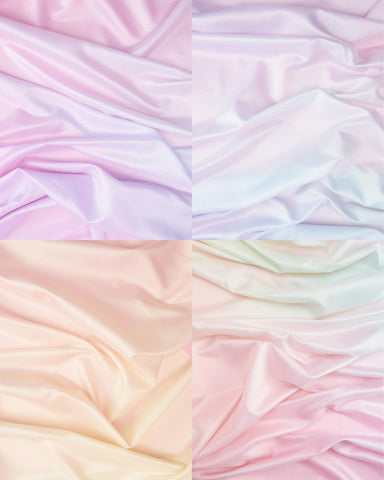 xo, Fetti pastel-gradient tablecloth decorating a rainbow baby shower table