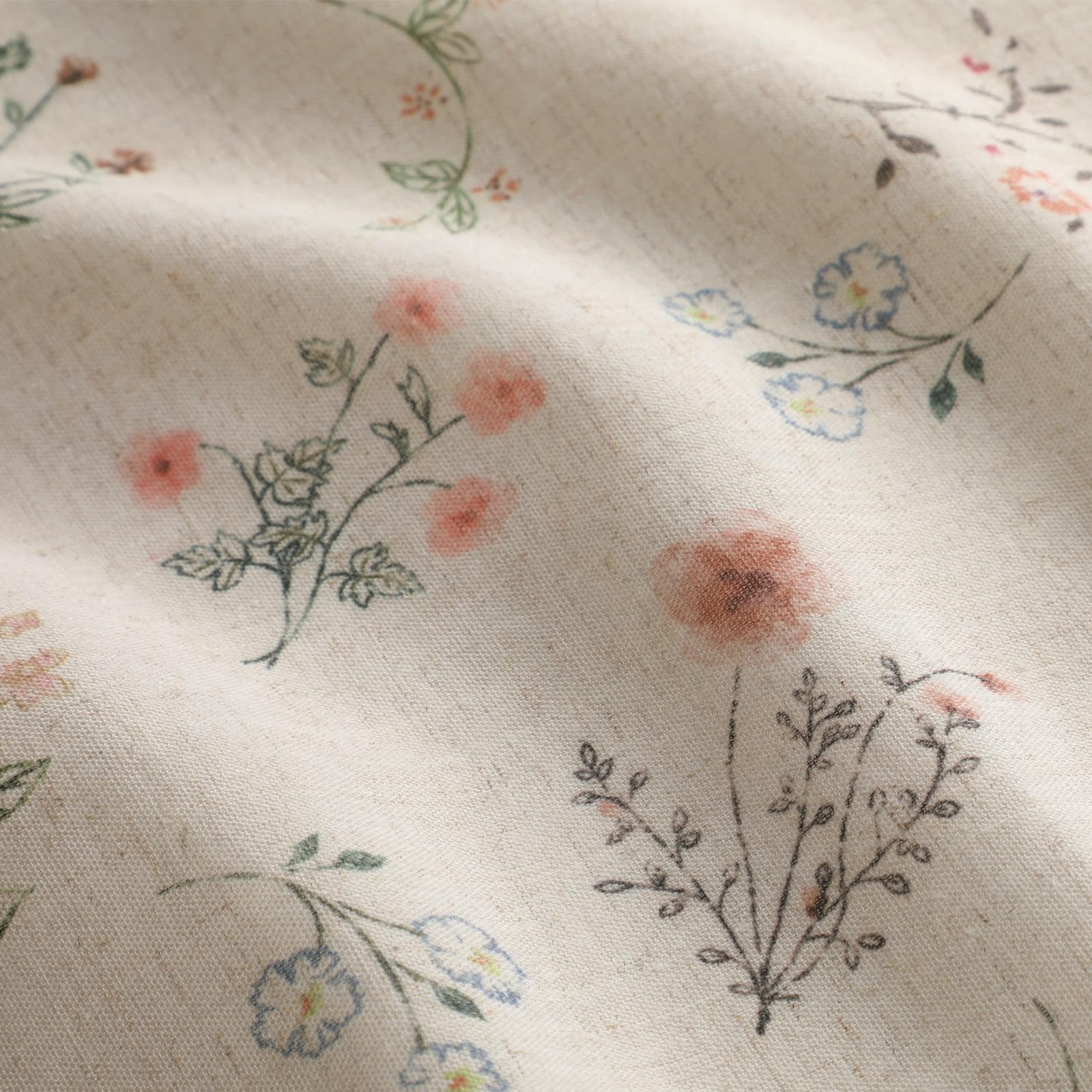 XOGUIBO closeup of beige tassels on floral curtains.