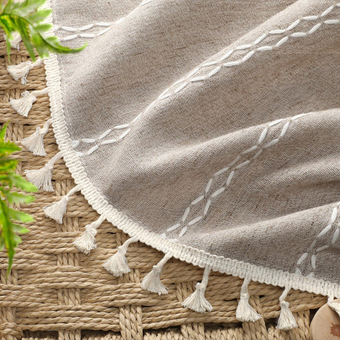 White cotton embroidery details on XOGUIBO curtains add vintage charm.