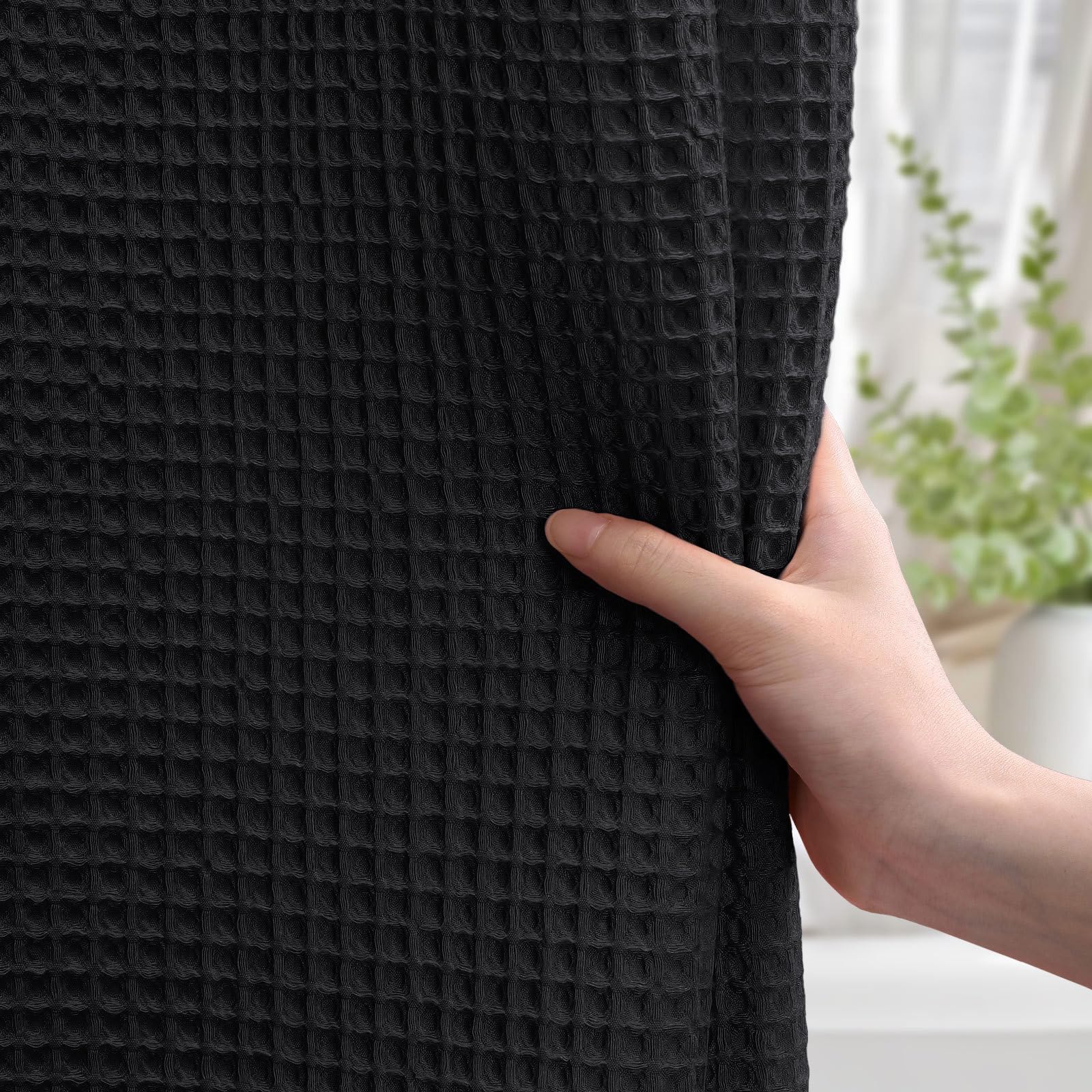 XOGUIBO heavyweight fabric curtain stays put for confident shower privacy.