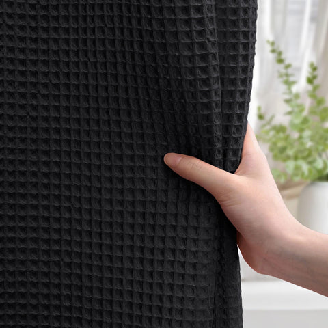 XOGUIBO heavyweight fabric curtain stays put for confident shower privacy.