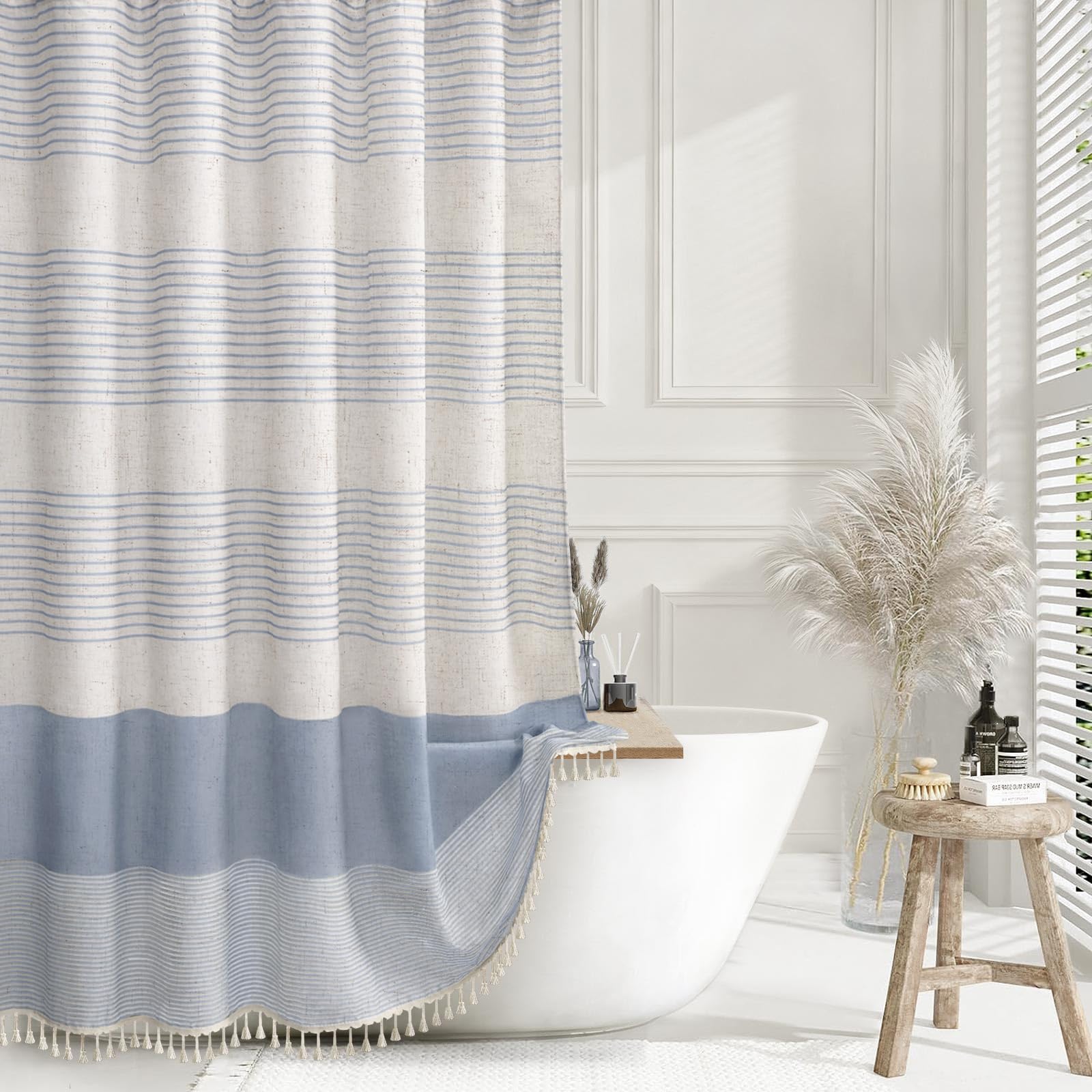 XOGUIBO light blue shower curtain highlights a linen texture for a soft, relaxing bathroom feel.