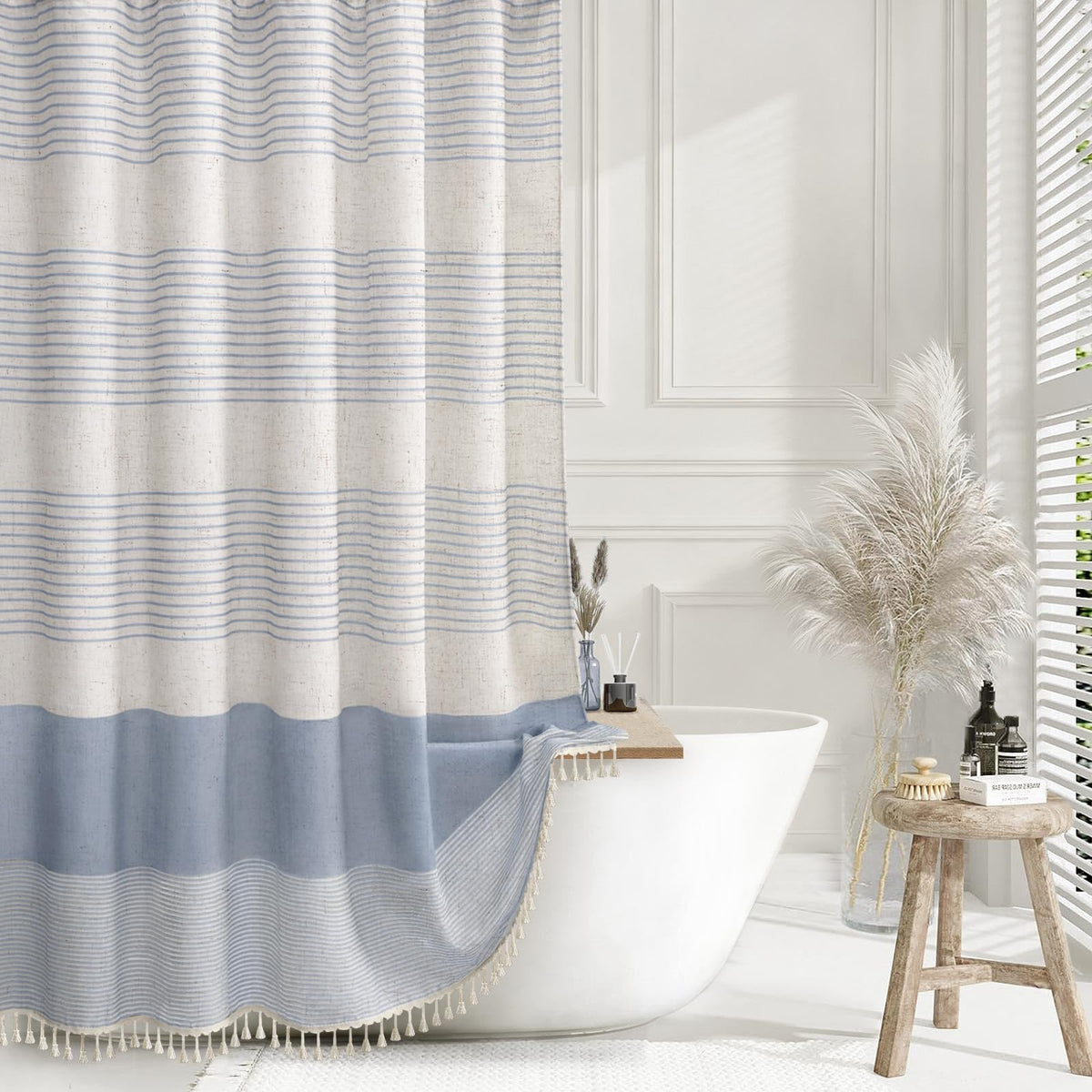 XOGUIBO light blue shower curtain highlights a linen texture for a soft, relaxing bathroom feel.