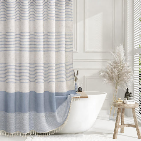 XOGUIBO light blue shower curtain highlights a linen texture for a soft, relaxing bathroom feel.