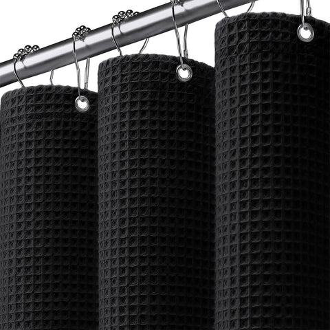XOGUIBO waffle-weave shower curtain with black texture provides privacy and style.
