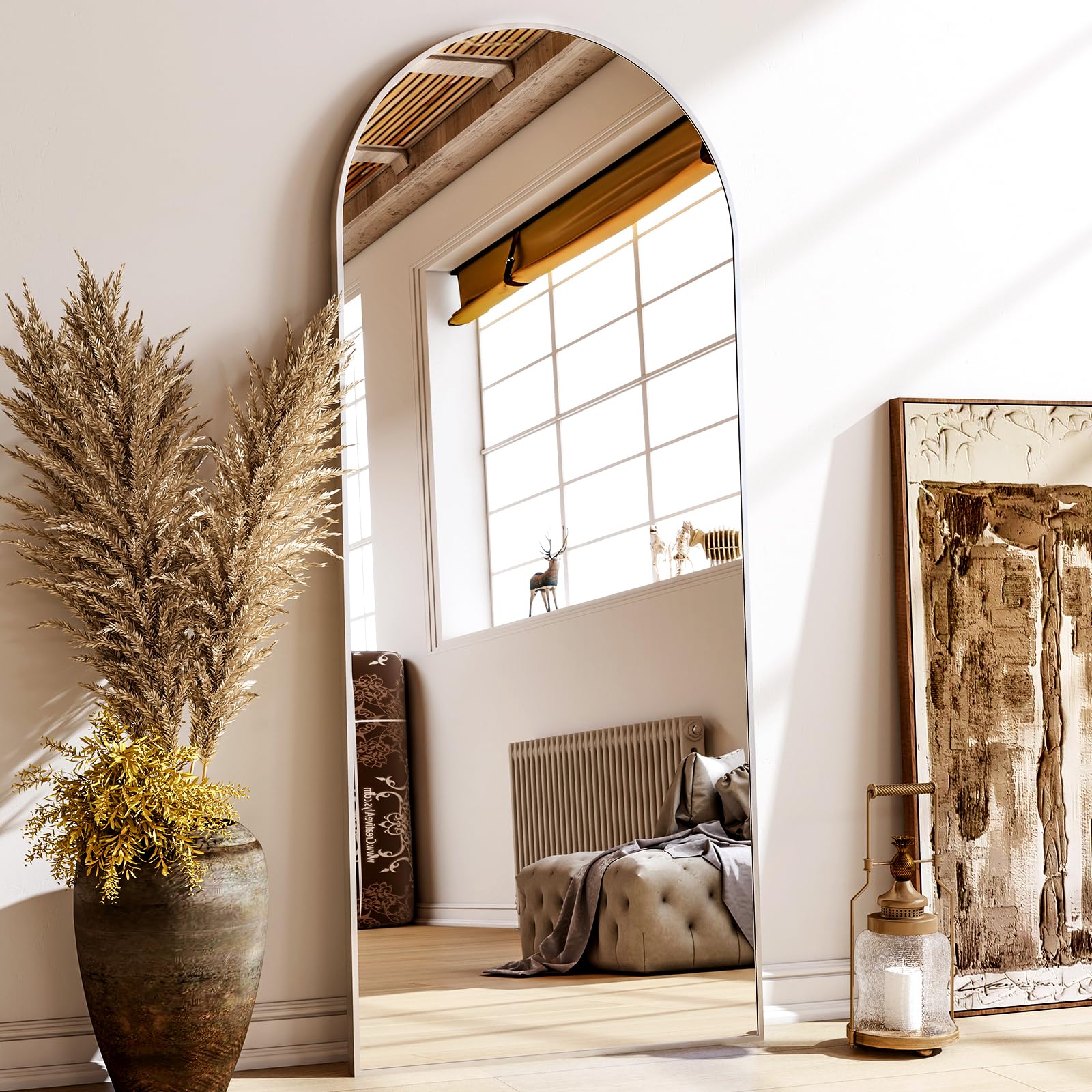 XRAMFY 56x21 floor mirror with an arched frame reflecting room lighting
