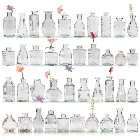 Yabool bud vase with clear embossed pattern highlighting stems for an elegant centerpiece.