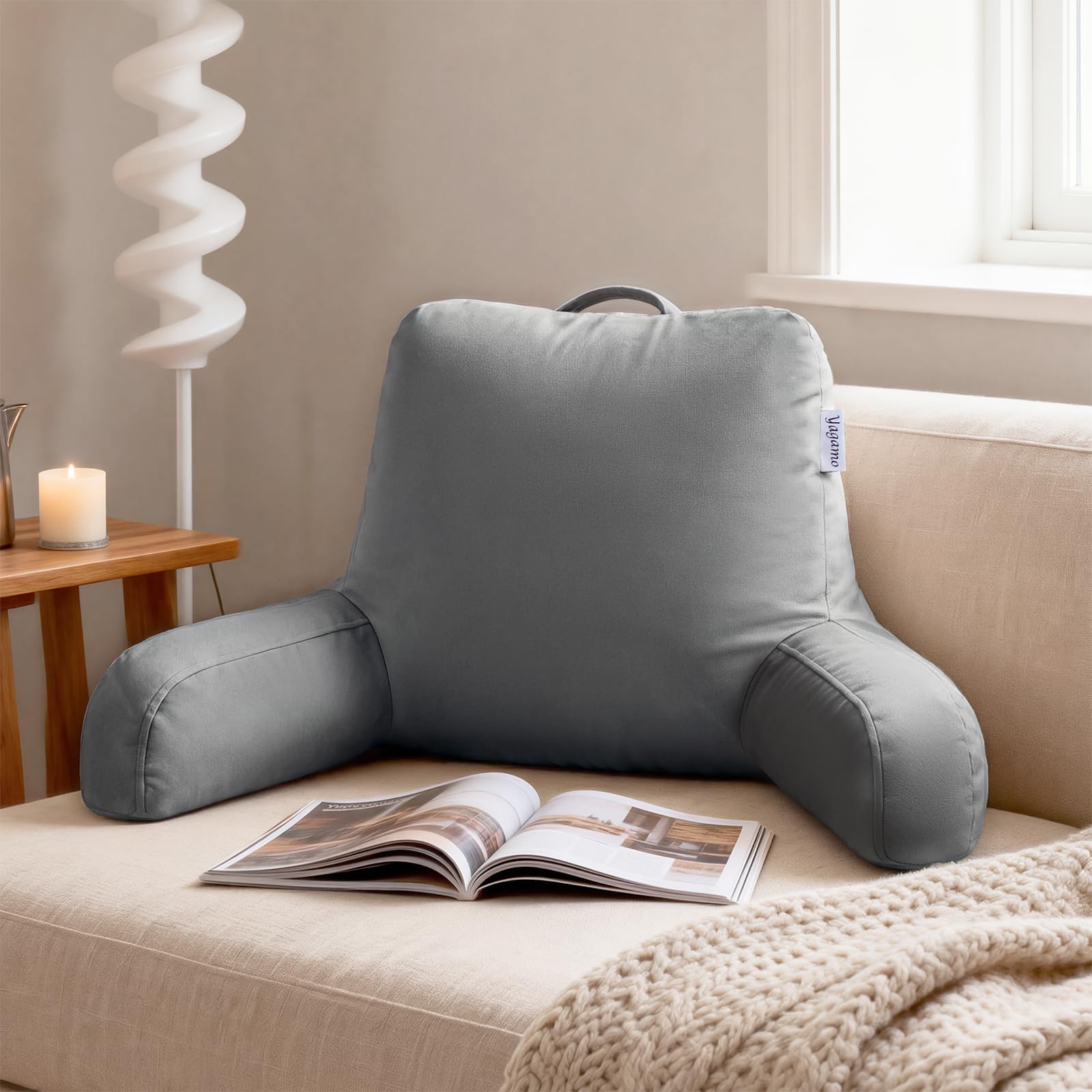Yagamo backrest with arms supports upright posture during reading.