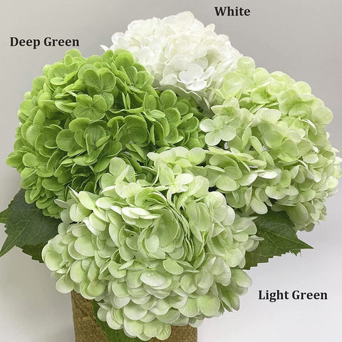 YalzoneMet wedding table decor featuring white and green hydrangeas.