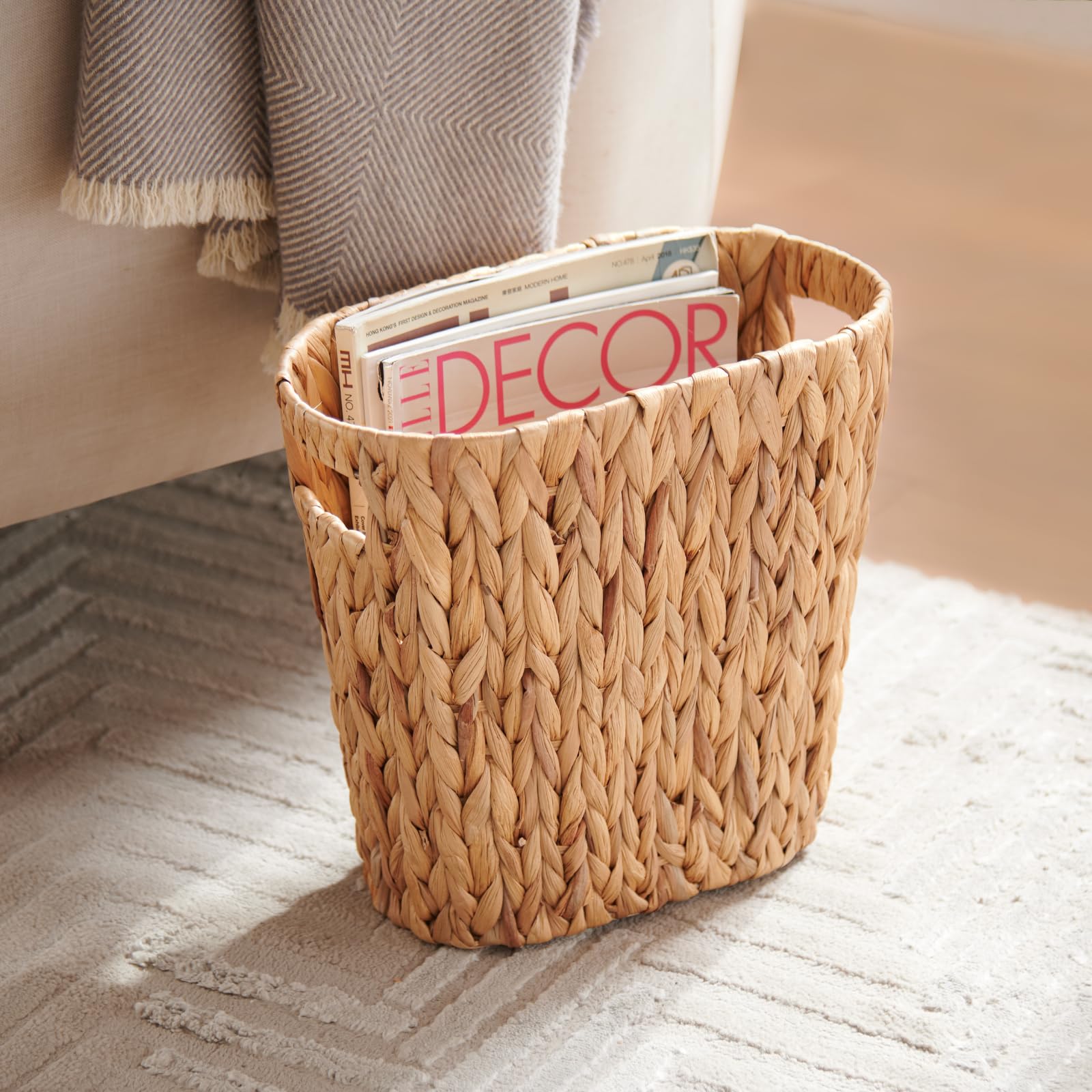 YangqiHome iron-frame wicker trash can with wooden handles for easy transport.