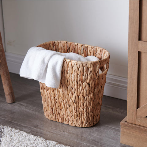 YangqiHome 13-inch wicker trash bin fits into tight bathroom corners.