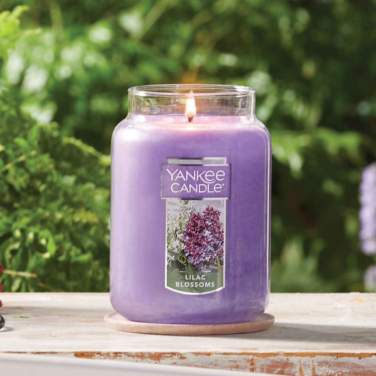 Yankee Candle Lilac Blossoms jar dimensions show generous 22oz capacity for longer fragrance.