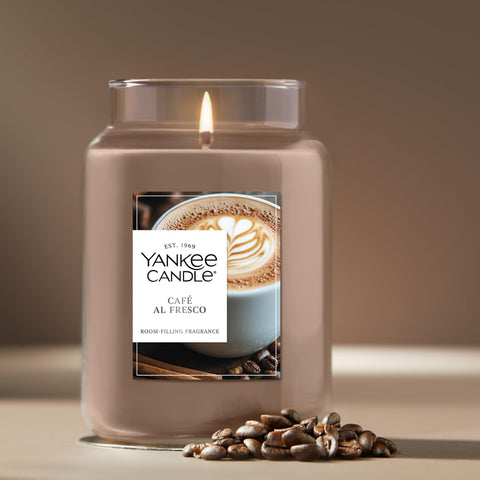 Yankee Candle Café Al Fresco lit candle creating cozy evenings