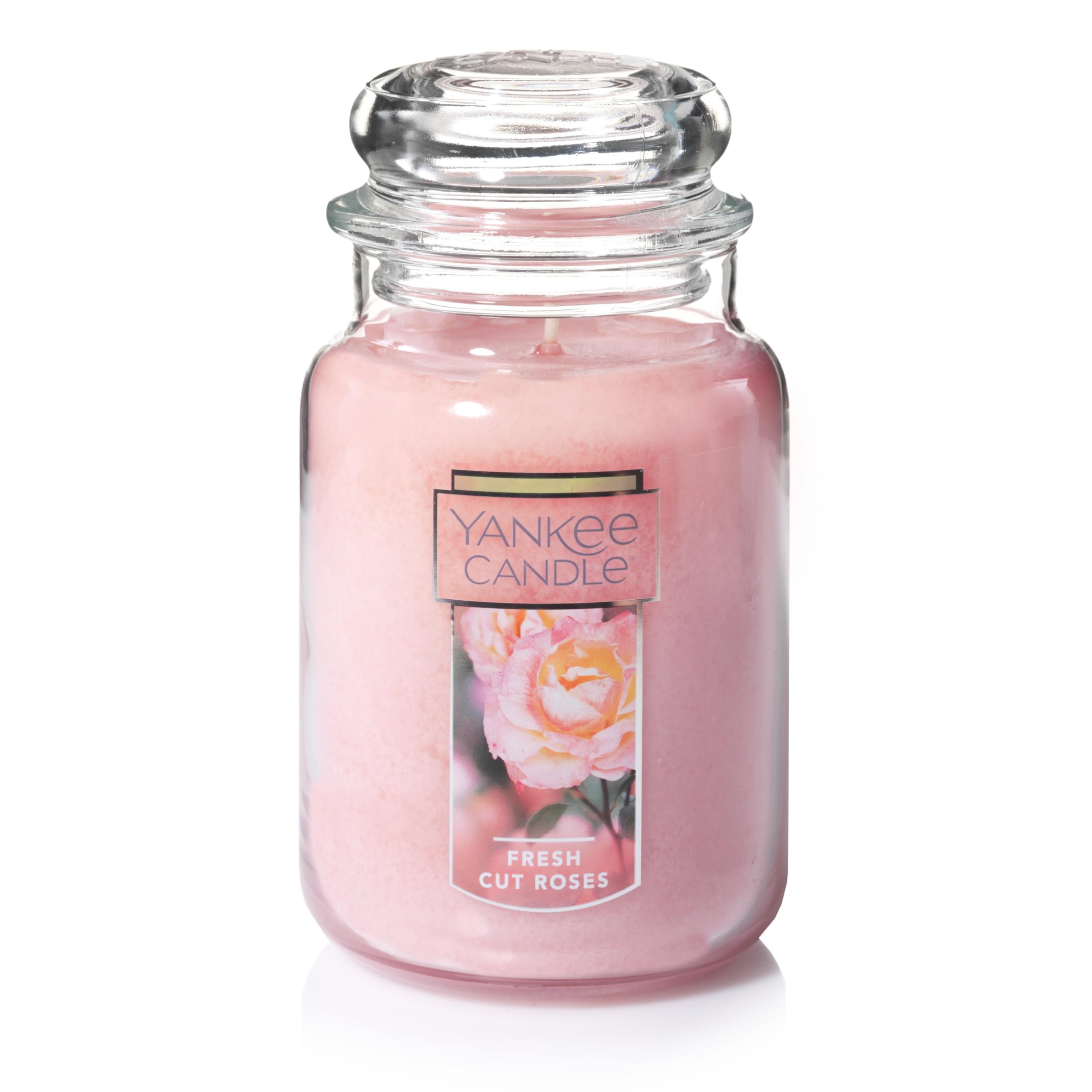 Yankee Candle Fresh Cut Roses 22oz jar with vibrant pink wax enhances ambiance.