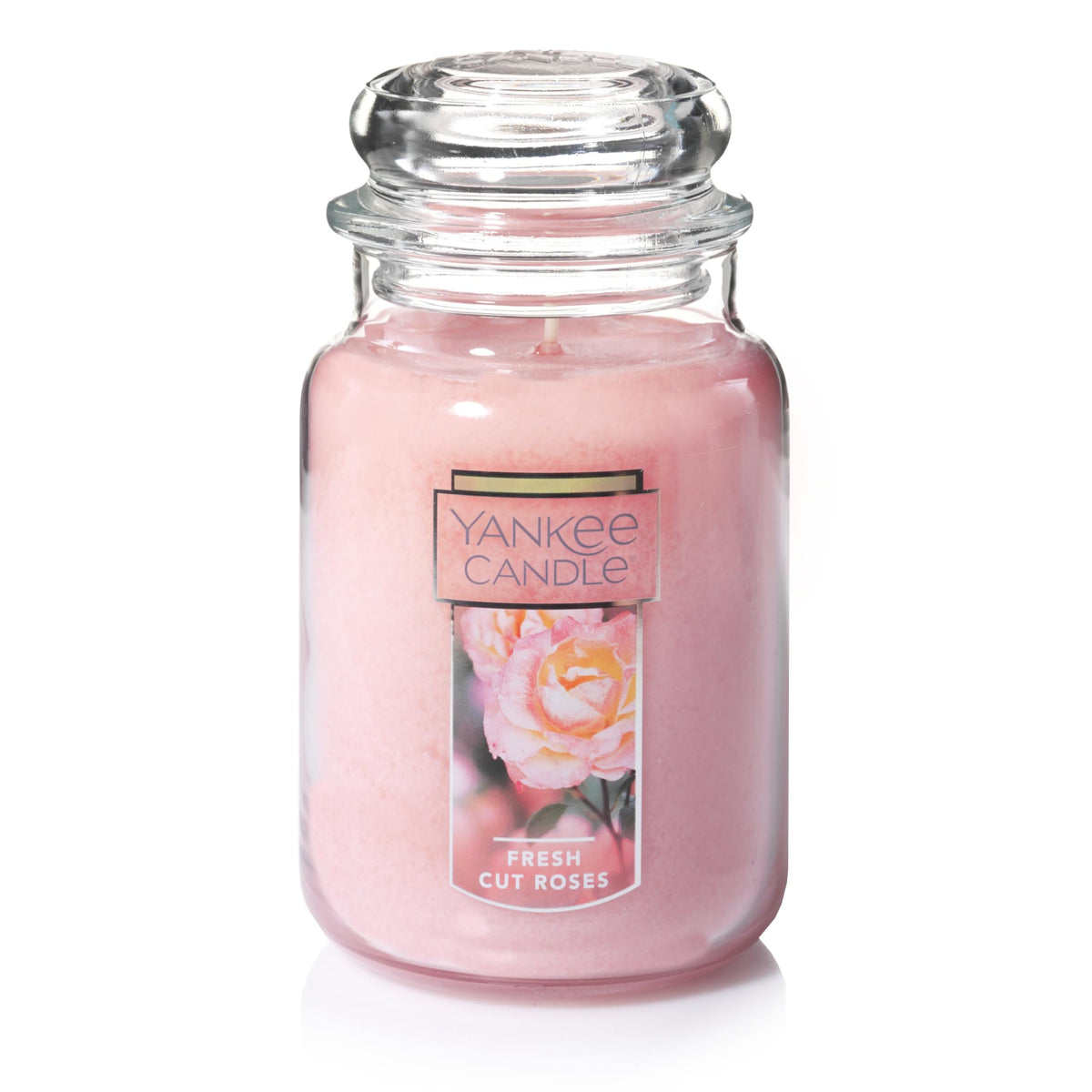 Yankee Candle Fresh Cut Roses 22oz jar with vibrant pink wax enhances ambiance.
