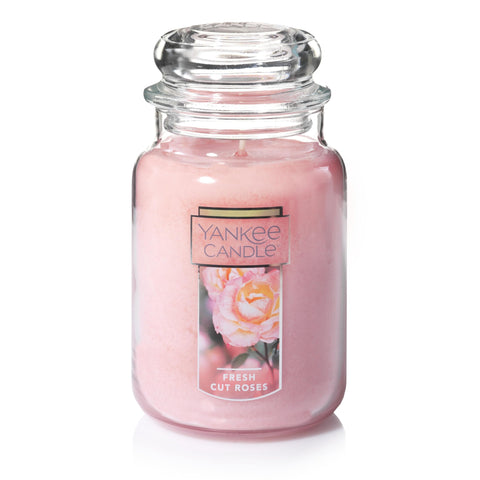 Yankee Candle Fresh Cut Roses 22oz jar with vibrant pink wax enhances ambiance.