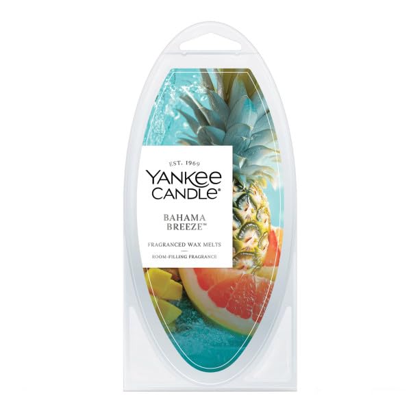 Yankee Candle Cliffside Sunrise melt in warmer releasing bright citrus and tropical notes.