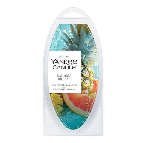 Yankee Candle Cliffside Sunrise melt in warmer releasing bright citrus and tropical notes.