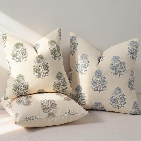 YCOLL floral pillow cover paired with bed for warm ambiance.