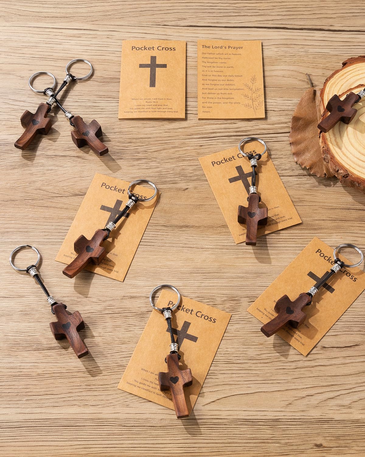 Compact cross keychain fits pockets and purses for quick reflection