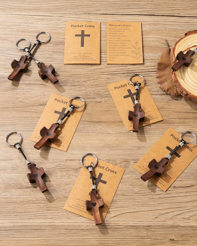 Compact cross keychain fits pockets and purses for quick reflection
