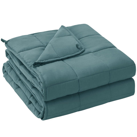 Yescool weighted blanket teal 60x80 on bed for cozy, cooling comfort.