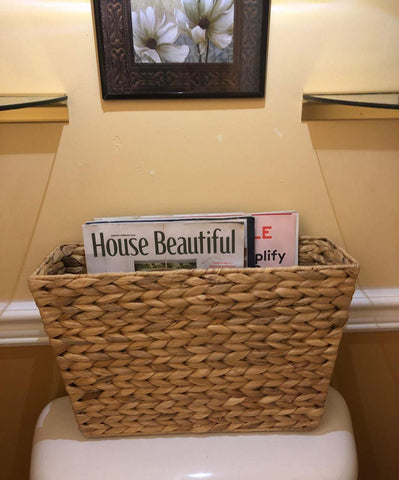 Yesland magazine basket with remote tidy demonstrates clutter reduction.