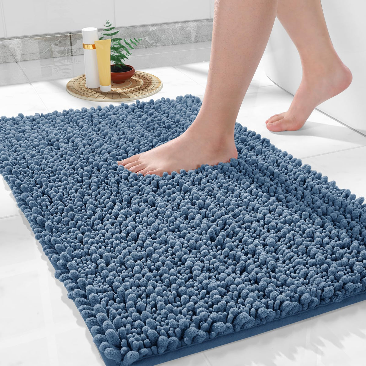 Yimobra bath mat in denim blue, 36x24, plush comfort underfoot after showers on tile, keeps floors dry.