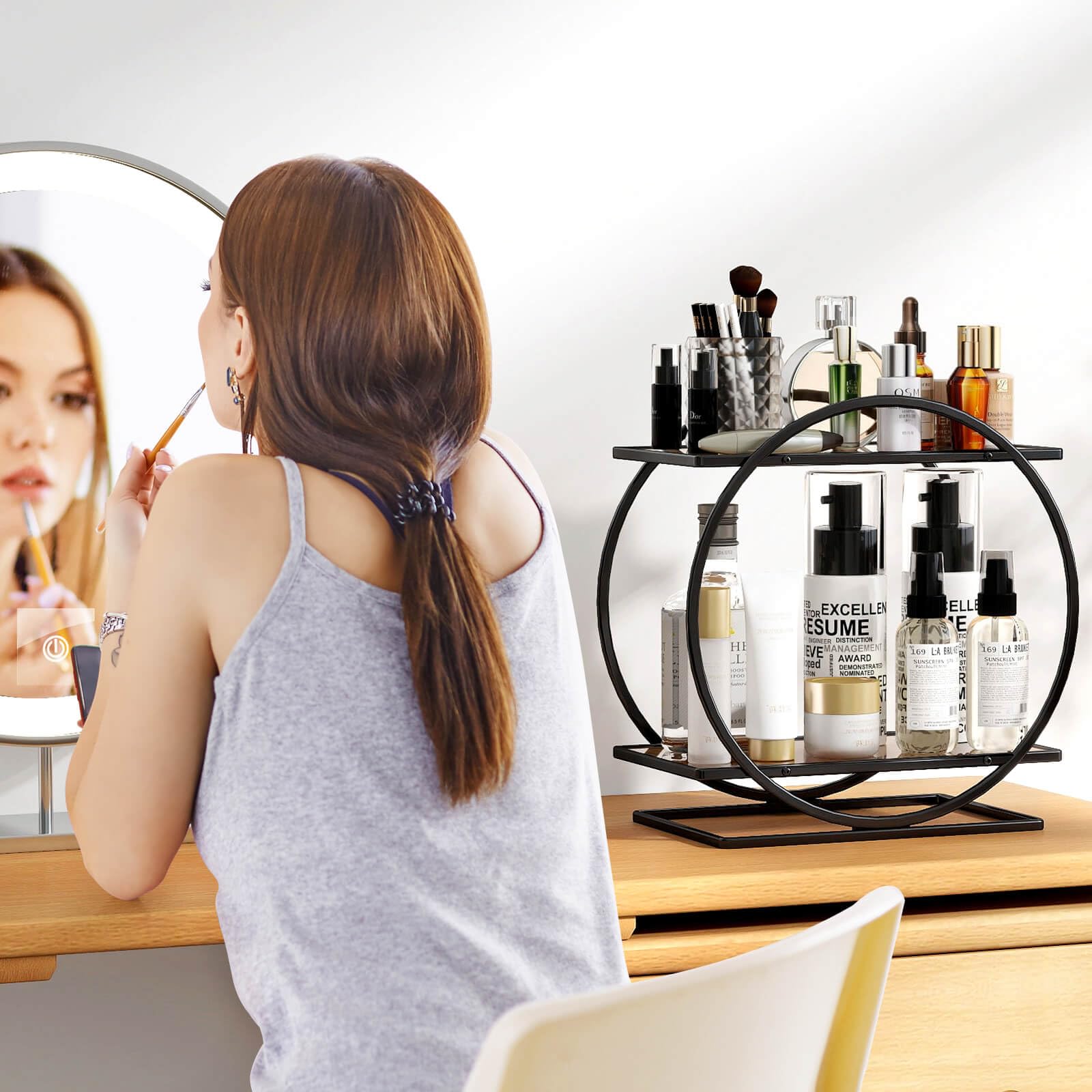 YIWANFW vanity organizer in black keeps cosmetics neatly displayed.