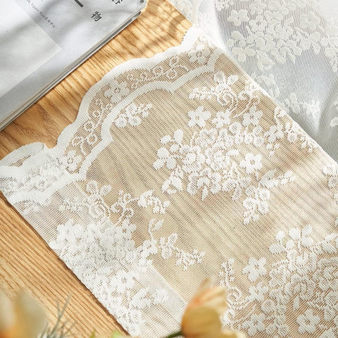 Boho farmhouse dining area styled with lace curtains