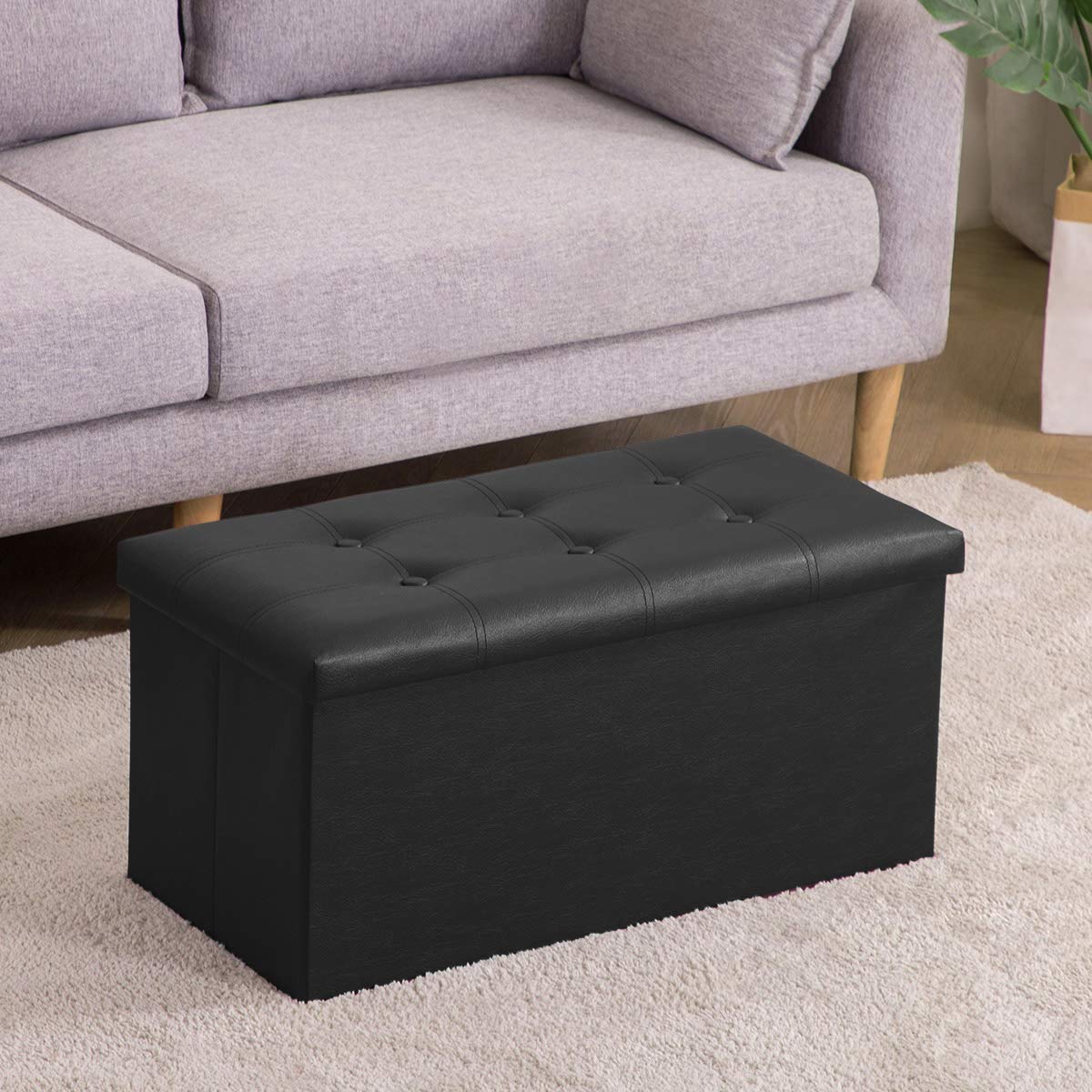 Youdesure black faux leather ottoman seat provides a sleek, easy-clean surface.