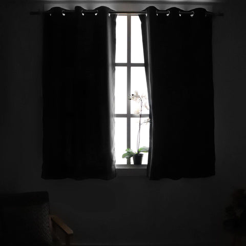 YoungsTex brown blackout curtains with silver grommets enable easy sliding.