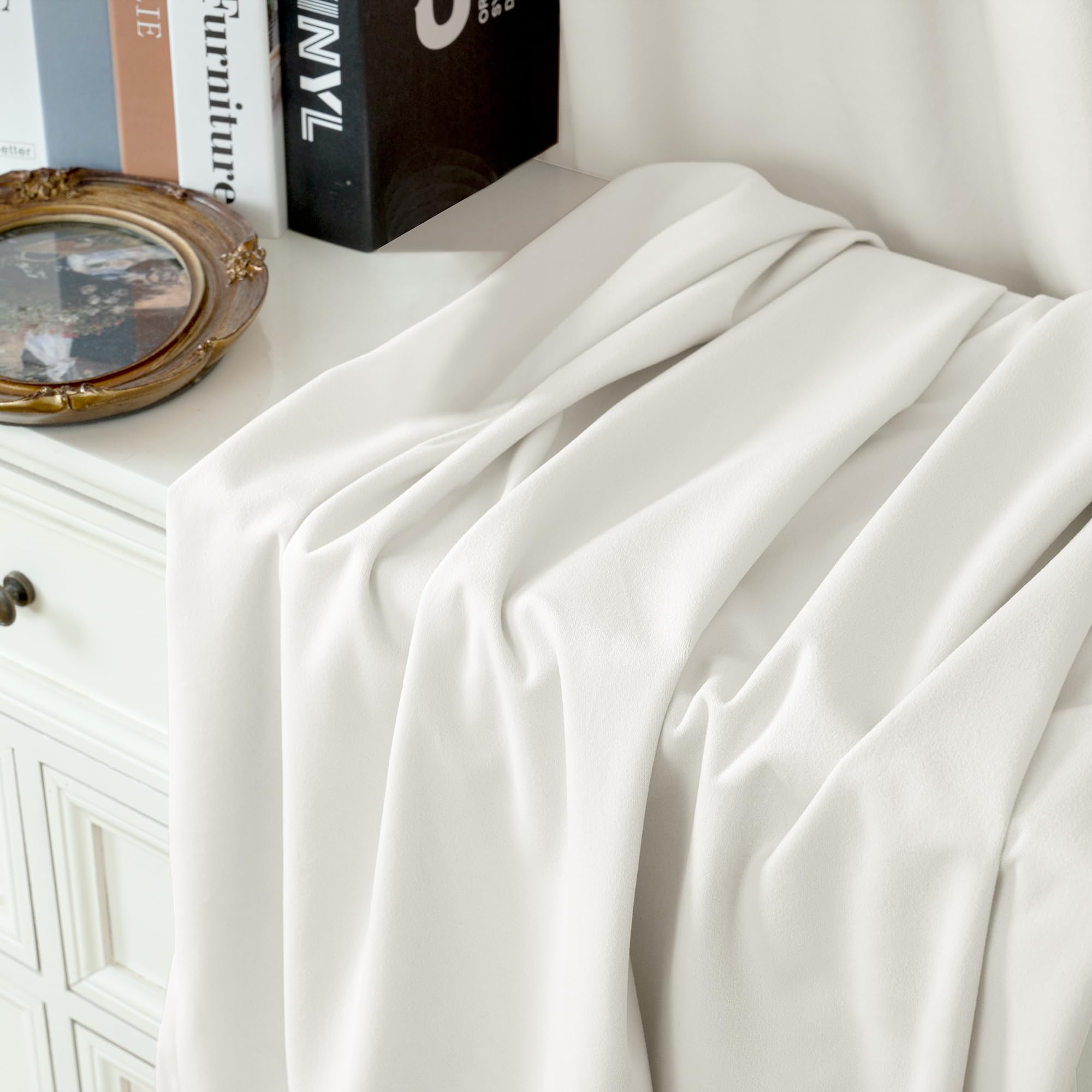 YoungsTex Ivory White Velvet Curtains demonstrate room-darkening performance for cozy evenings.
