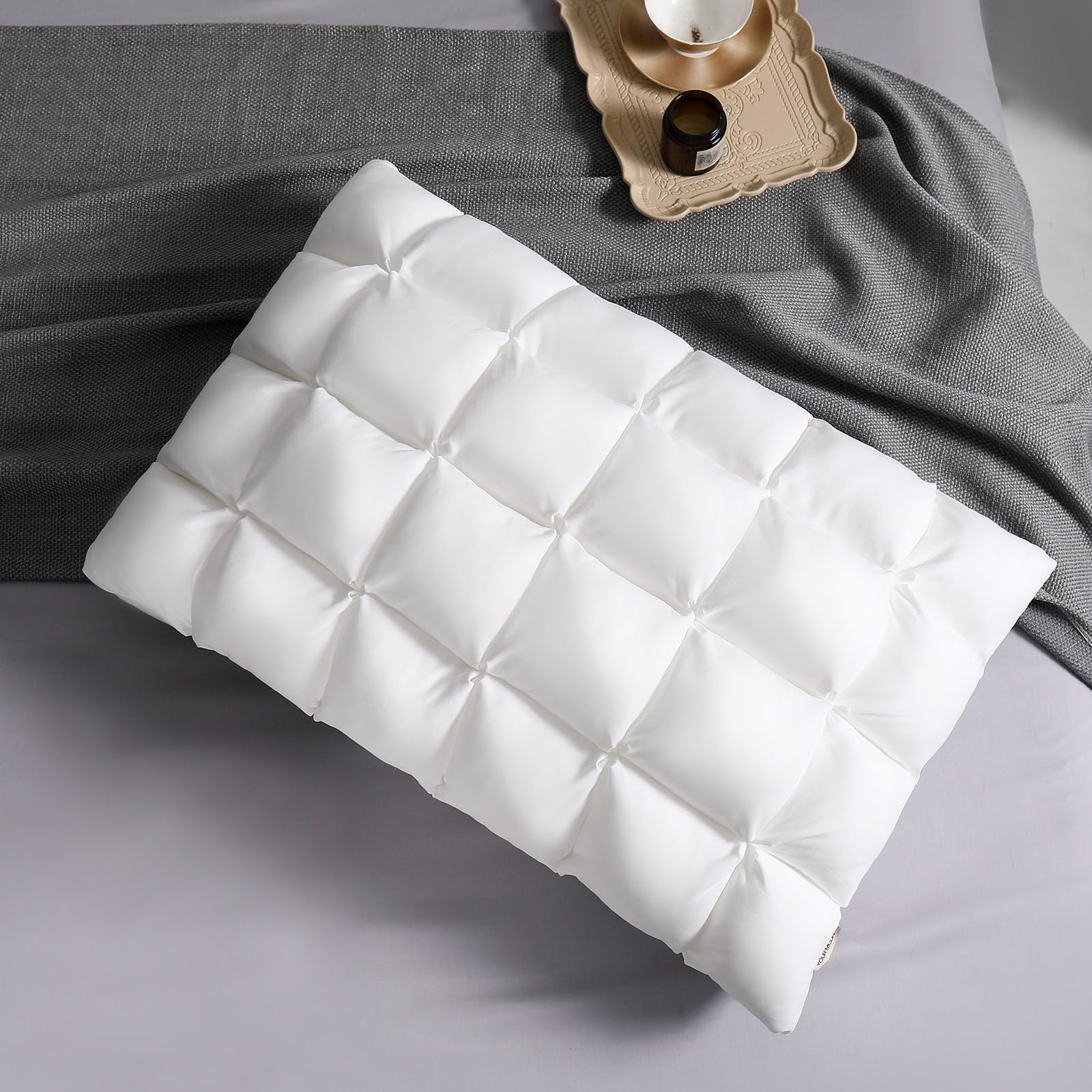 YOUR MOON soft pillow on bed provides plush support for restful sleep.