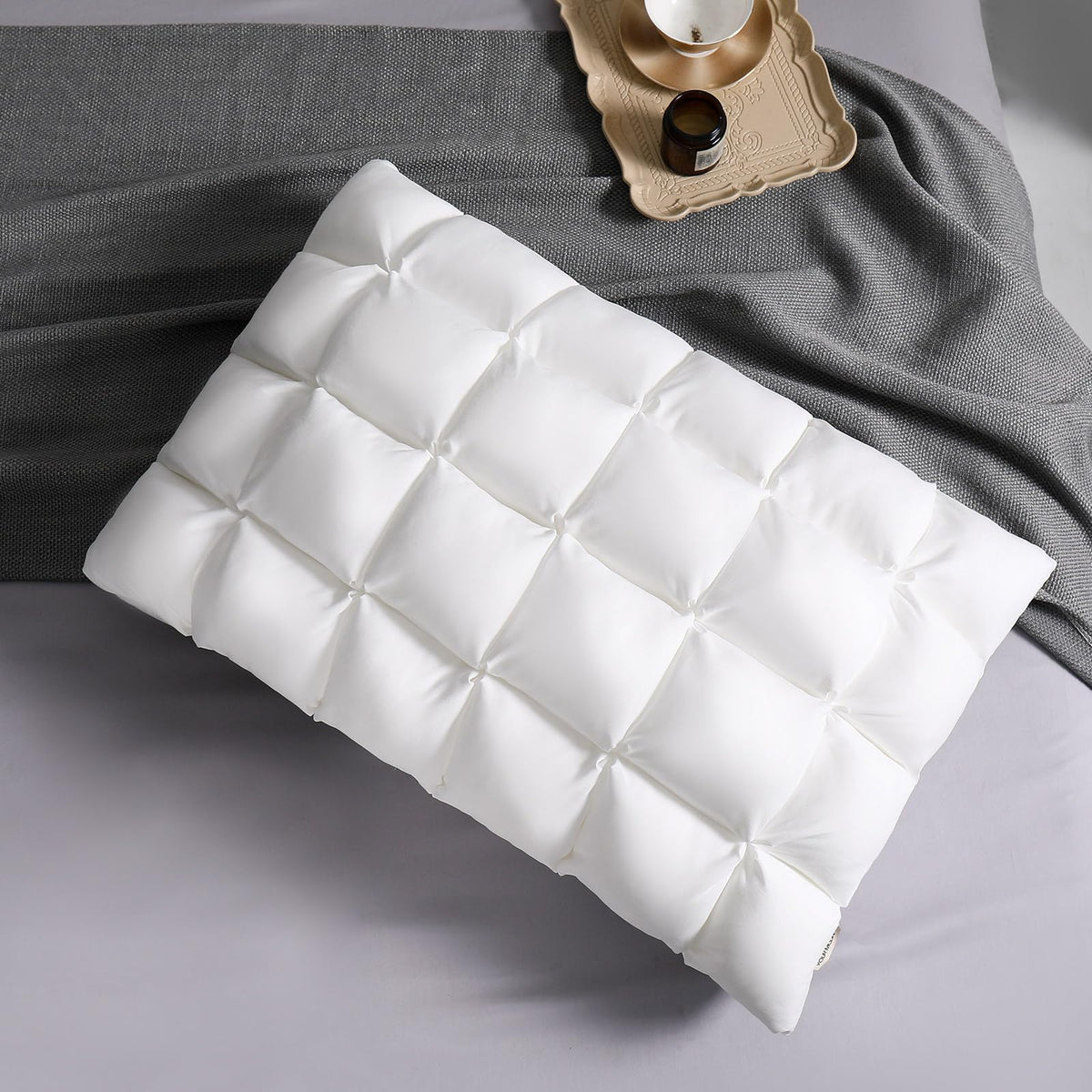 YOUR MOON soft pillow on bed provides plush support for restful sleep.