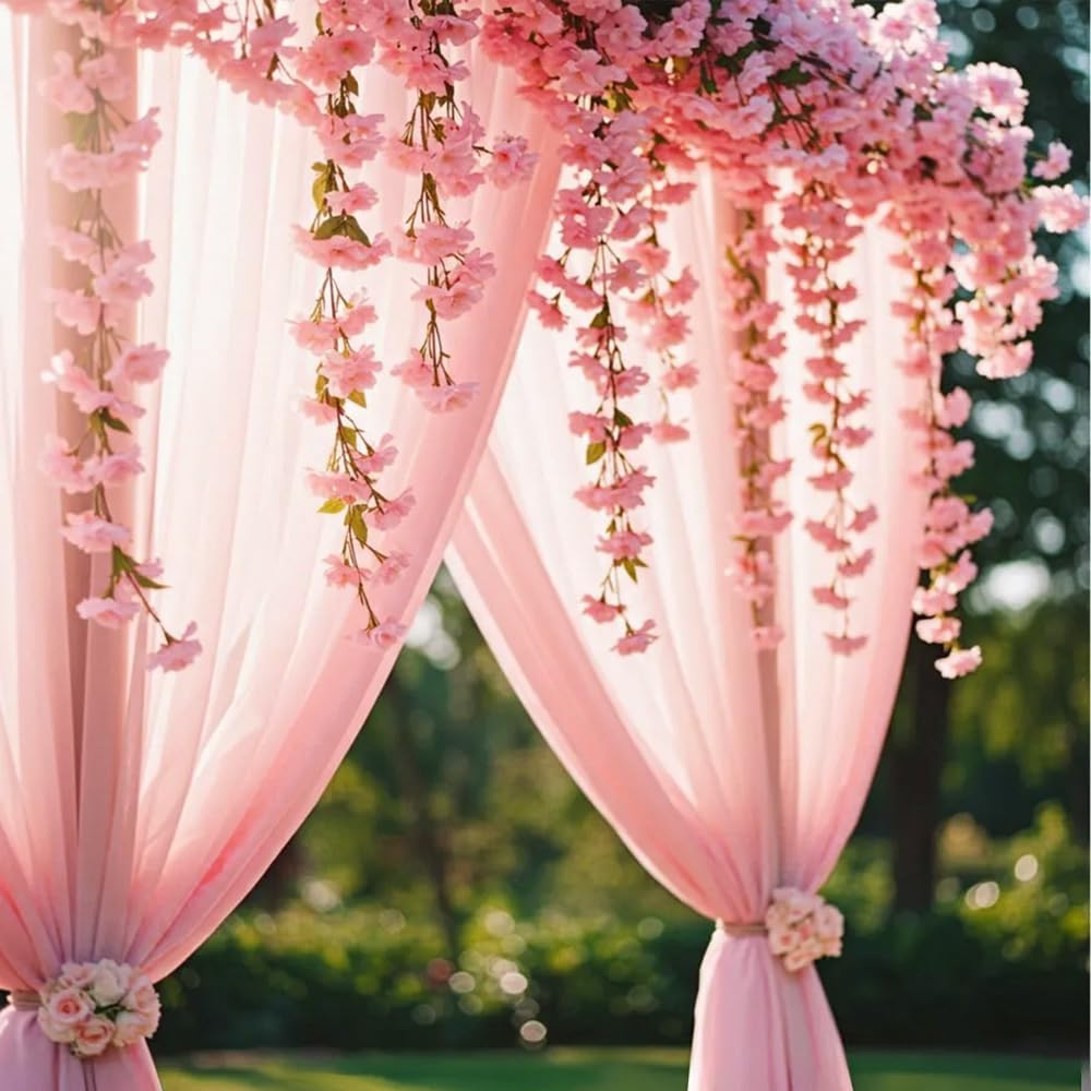 YRIOWMI arch draping cherry blossom garland at a party backdrop