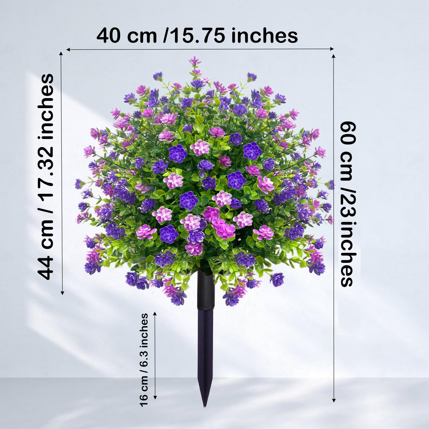 YUGYUM purple blooms and green leaves brighten porch or doorway.